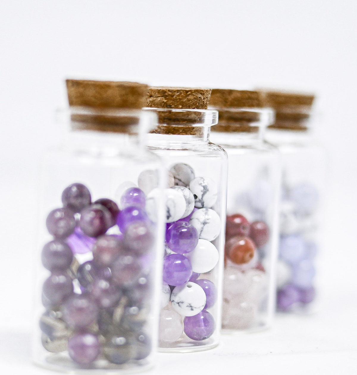 Examples of crystal Power Vials. Each purchase includes one glass vial with three chosen stone types.