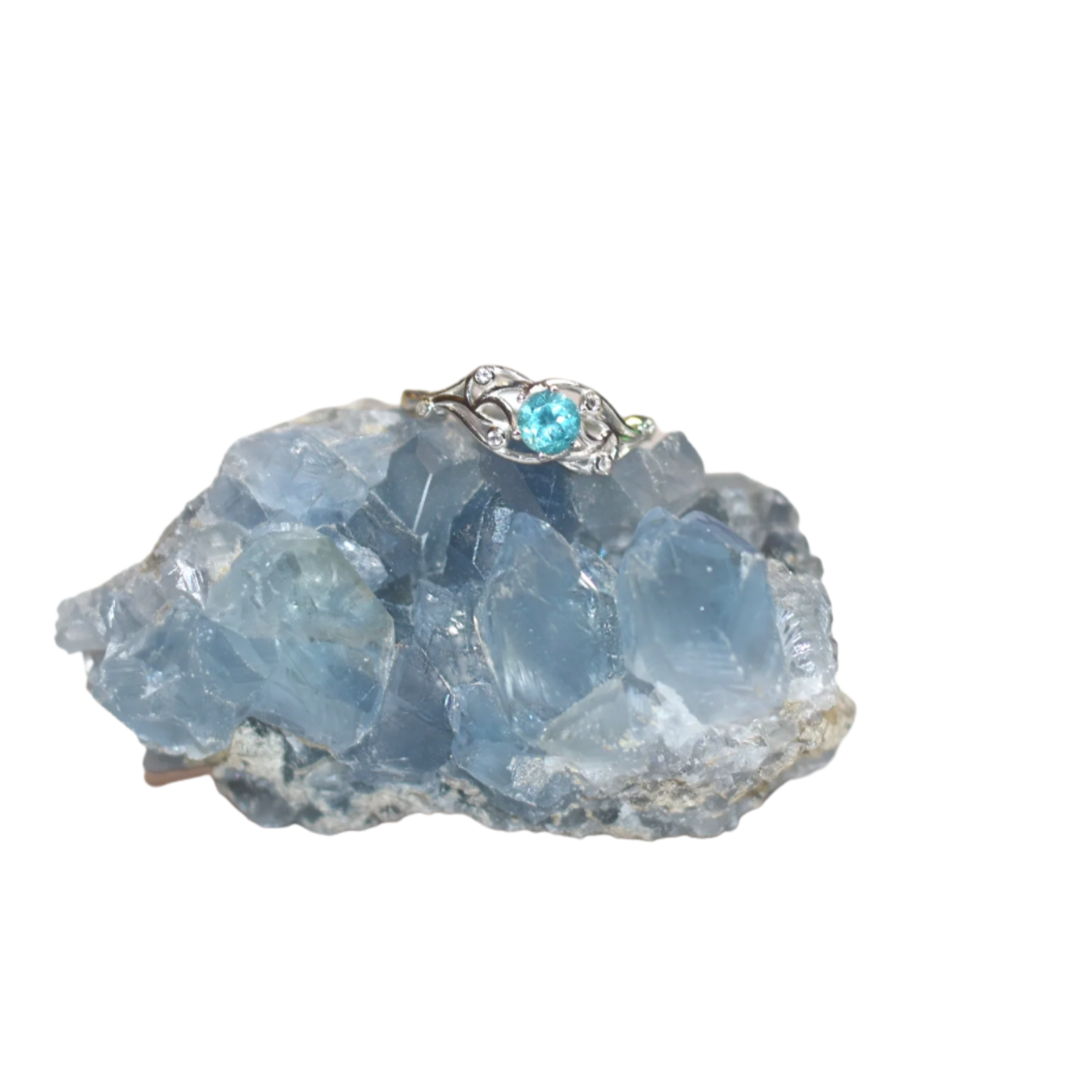 A Sterling Silver ring featuring a vibrant blue Apatite stone, set in a metallic silver band.